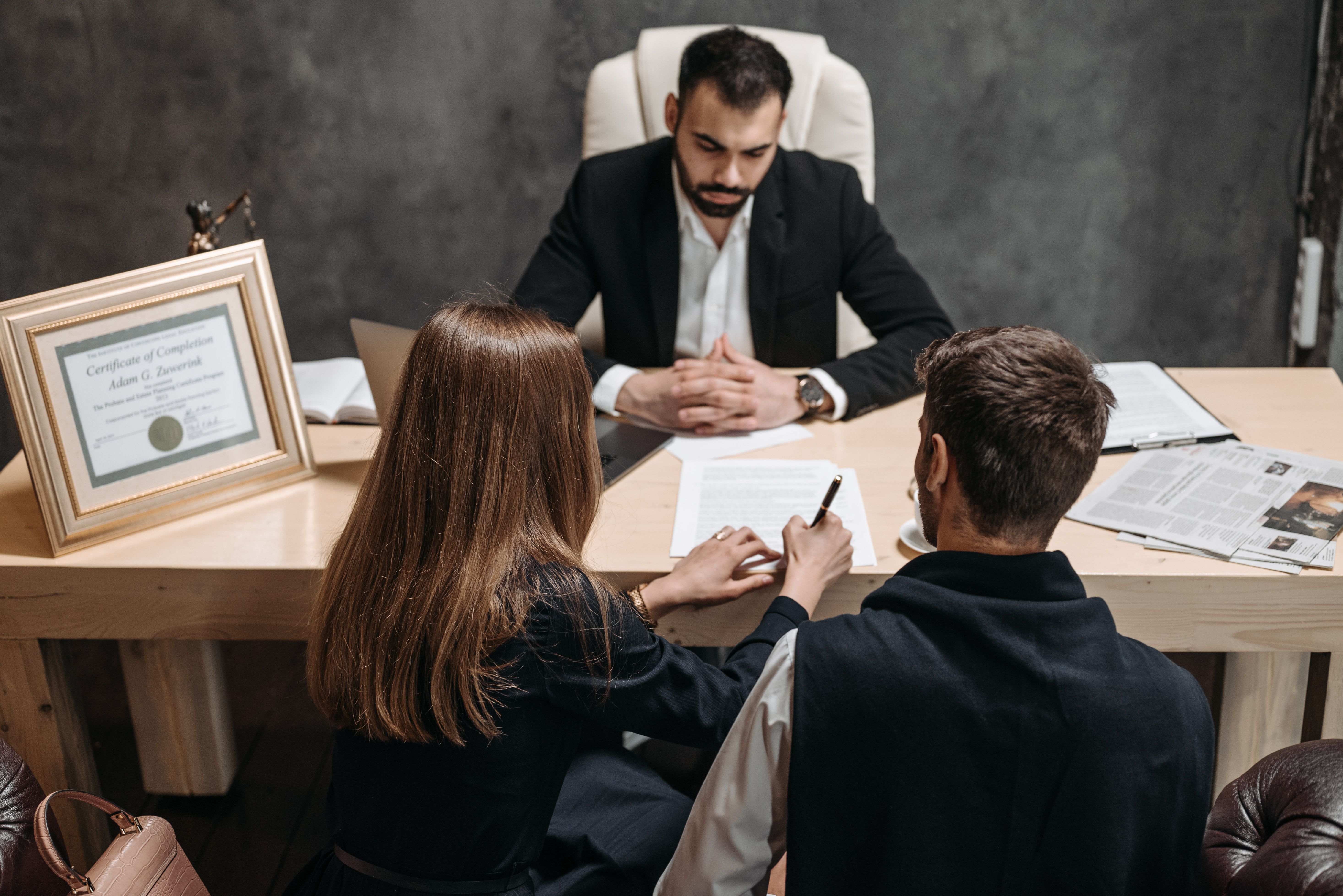 Attorney consulting with clients